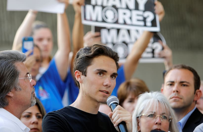 David Hogg, a senior at Marjory Stoneman Douglas High School, speaks at a rally calling for more gun control three days after the shooting at his school (photo credit: JONATHAN DRAKE / REUTERS)
