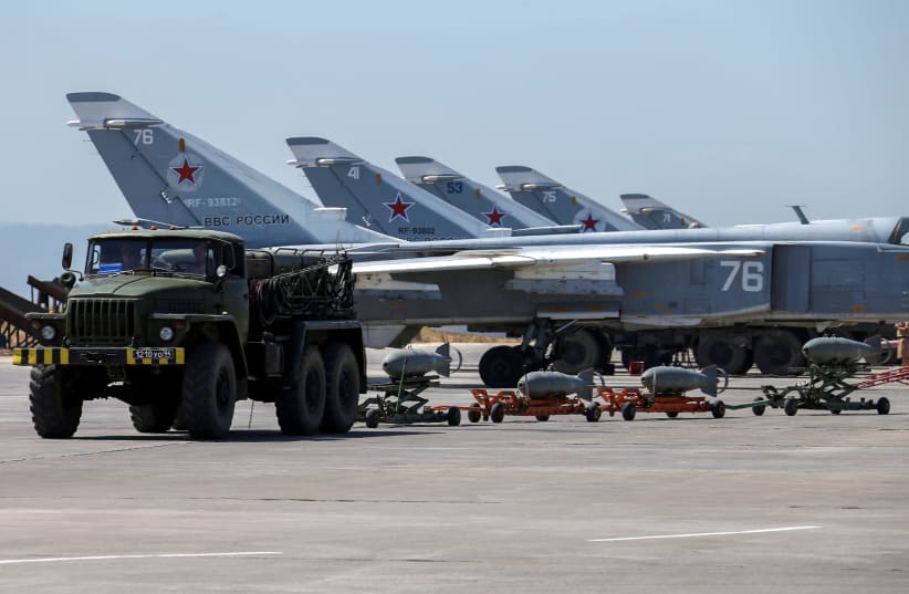 Russian military jets are seen at Hmeymim air base in Syria (photo credit: REUTERS/VADIM SAVITSKY/RUSSIAN DEFENSE MINISTRY VIA REUTERS)