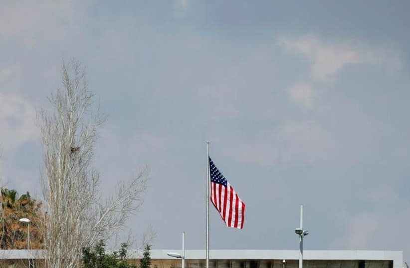 An United States flag flies over a complex belonging to the U.S. consulate in Jerusalem February 24, 2018 (photo credit: REUTERS/AMMAR AWAD)