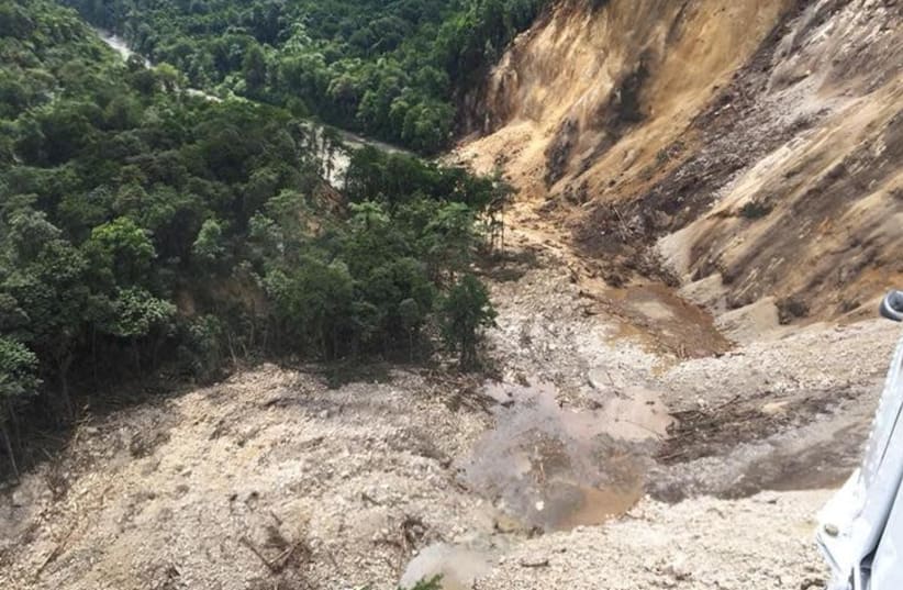 Areas affected by landslides are seen after a powerful 7.5 magnitude earthquake, in Hela, Papua New Guinea February 26, 2018 in this picture obtained from social media. Picture taken February 26, 2018. BERNARD JAMES MCQUEEN /via REUTERS (photo credit: BERNARD JAMES MCQUEEN/VIA REUTERS)