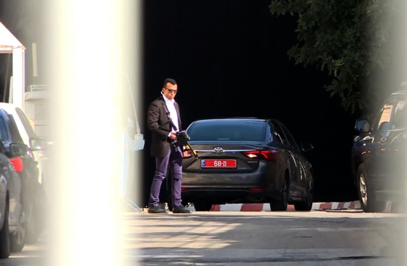 An image grab taken from an AFP video shows a vehicle belonging to the Israeli police at the entrance to the residence of Israeli Prime Minister Benjamin Netanyahu on March 2, 2018. (photo credit: AHIKAM SERI / AFP)