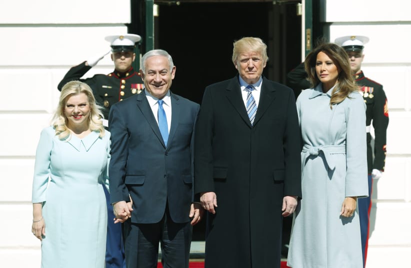 U.S. President Donald Trump and first lady Melania Trump welcome Israeli Prime Minister Benjamin Netanyahu and Mrs. Netanyahu at the White House in Washington, U.S., March 5, 2018. (photo credit: KEVIN LAMARQUE/REUTERS)