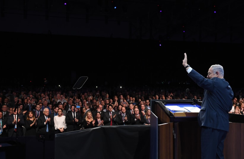 Prime Minister Benjamin Netanyahu addressing the 2018 AIPAC conference (photo credit: CHAIM ZACH / GPO)