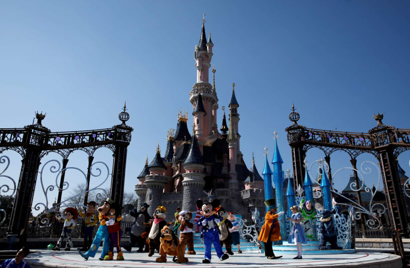 Disney characters attend the 25th anniversary of Disneyland Paris at the park in Marne-la-Vallee, near Paris, France, March 25, 2017 (photo credit: REUTERS)