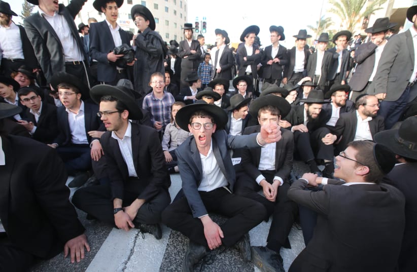 Young haredim take part in a protest against mandatory IDF conscription, March 2018 (photo credit: MARC ISRAEL SELLEM/THE JERUSALEM POST)