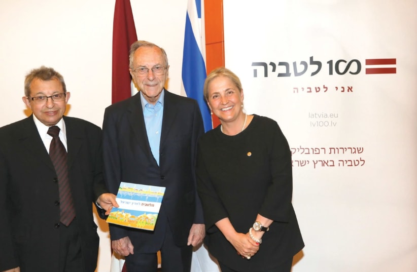 Moshe Arens, flanked by Eliahu Valk and Latvian Ambassador to Israel Elita Gavel (photo credit: SIVAN FARAG)