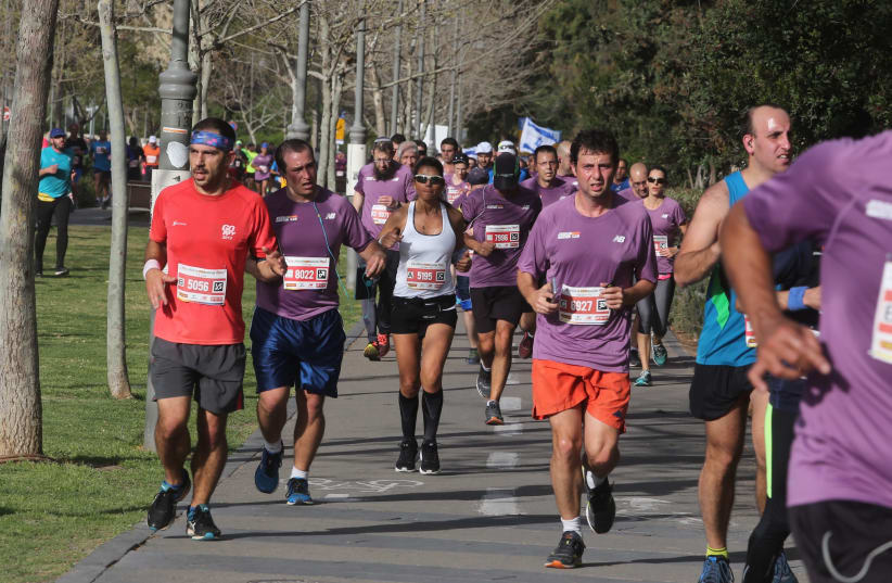 Runners participate in the Jerusalem marathon, March 2018 (photo credit: MARC ISRAEL SELLEM/THE JERUSALEM POST)