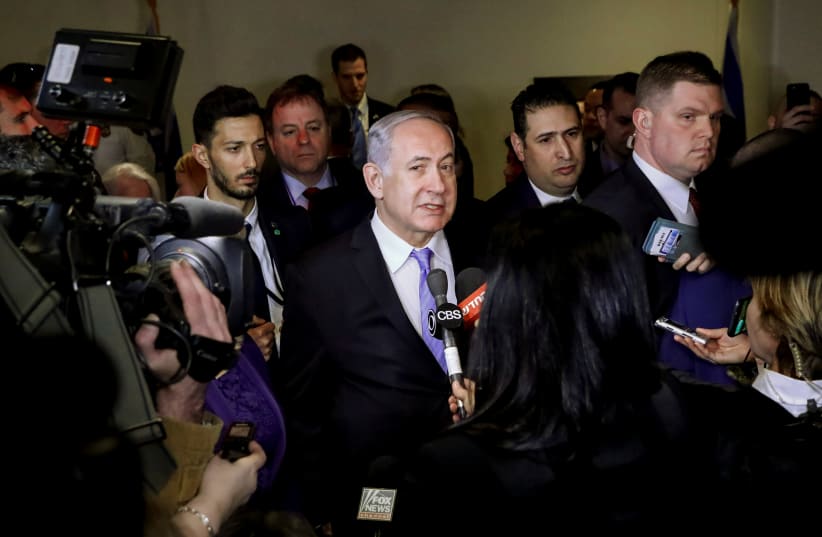 Israeli Prime Minister Benjamin Netanyahu speaks to the press during the opening of a special exhibit on Jewish presence in Jerusalem at the United Nations Headquarters in New York City, U.S., March 8, 2018. (photo credit: REUTERS/BRENDAN MCDERMID)