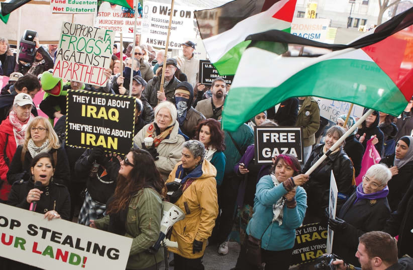 PROTESTERS ATTEND an anti-AIPAC rally in 2012 (photo credit: REUTERS)