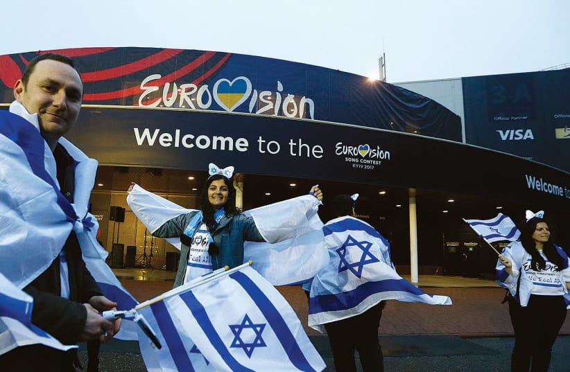 Israeli fans wave flags before last year’s Eurovision Song Contest Grand Final at the International Exhibition Center in Kiev, Ukraine (photo credit: REUTERS/VALENTYN OGIRENKO)