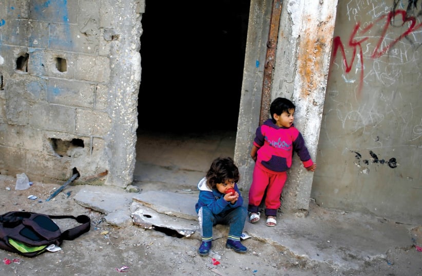 IMPOVERISHED CHILDREN in Gaza City’s Shati refugee camp. (photo credit: MOHAMMED SALEM/REUTERS)
