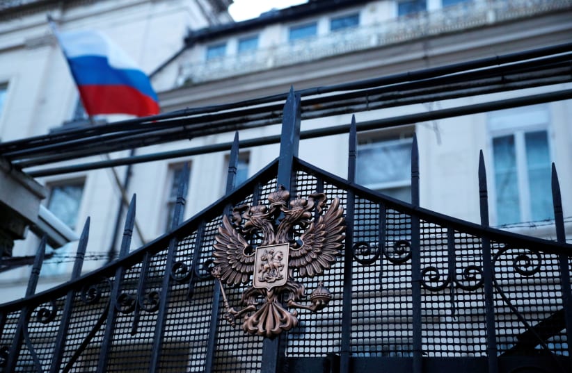 Russia's flag flies from the consular section of its embassy, in central London, Britain March 14, 2018.  (photo credit: REUTERS)