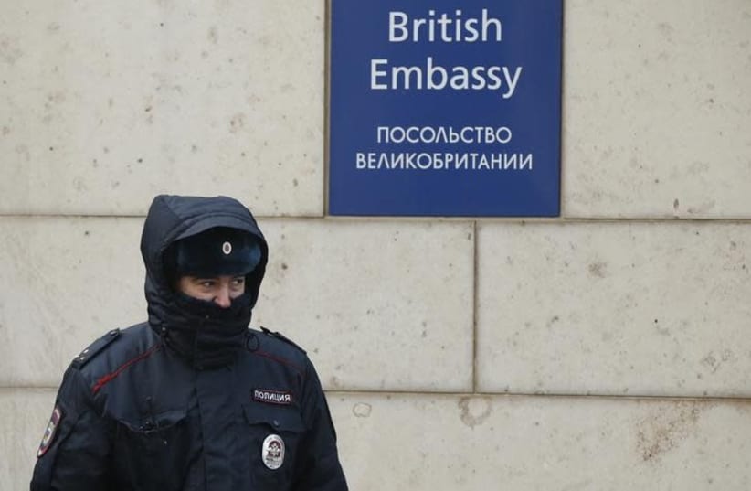 A Russian policeman walks outside the British embassy in Moscow, Russia, March 17, 2018 (photo credit: DAVID MDZINARISHVILI/REUTERS)