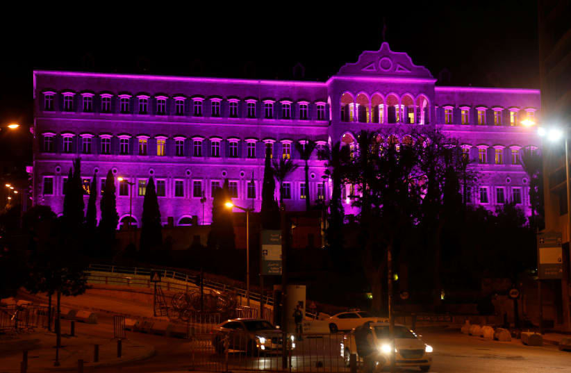 Lebanon's government palace is seen illuminated purple to mark International Women's Day in downtown Beirut, Lebanon March 7, 2017.  (photo credit: MOHAMED AZAKIR / REUTERS)