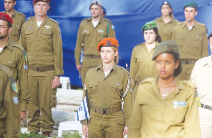 Male and female soldiers remember the fallen at a Remembrance Day ceremony on Jerusalem’s Mount Herzl (photo credit: MARC ISRAEL SELLEM)