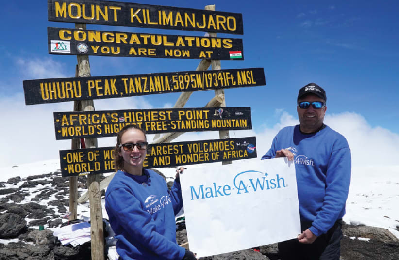 Avi Bar Aharon and Noga Barkan at the top of Mount Kilimanjaro (photo credit: YARIV DAGAN)