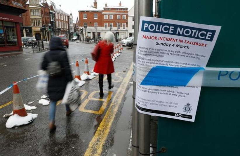 A police notice is attached to screening surrounding a restaurant which was visited by former Russian intelligence officer Sergei Skripal and his daughter Yulia before they were found on a park bench after being poisoned in Salisbury, Britain, March 19, 2018 (photo credit: REUTERS/PETER NICHOLLS)