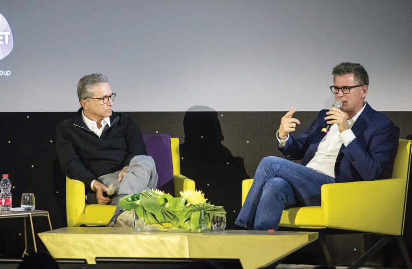 SUPER-AGENT Rick Rosen (left) and TBS/TNT president Kevin Reilly take the stage at the INTV Conference (photo credit: ODED CARNI)