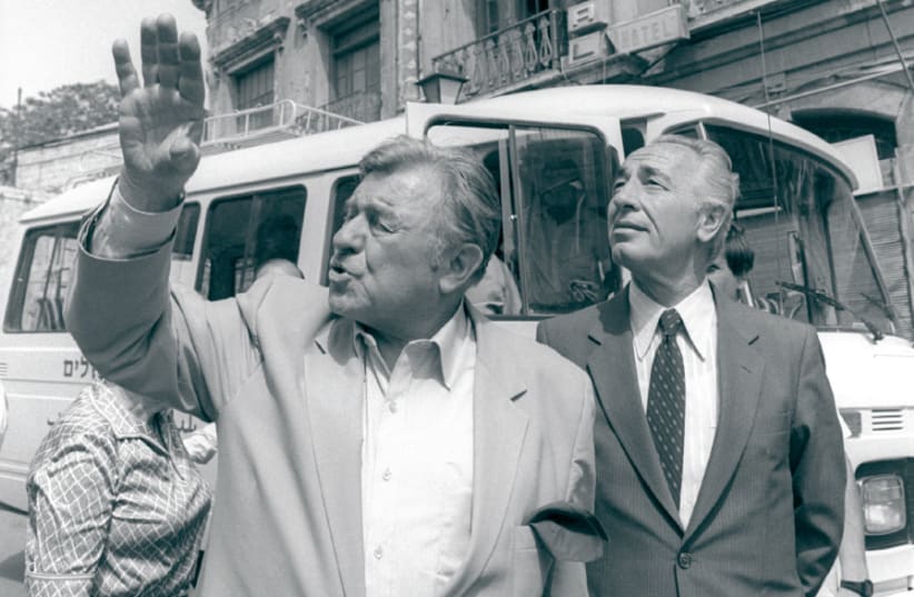 JERUSALEM MAYOR Teddy Kollek (left) points out special landmarks to then-prime minister Shimon Peres during a walking tour of Jerusalem in 1985 (photo credit: HERMAN CHANANIA/GPO)