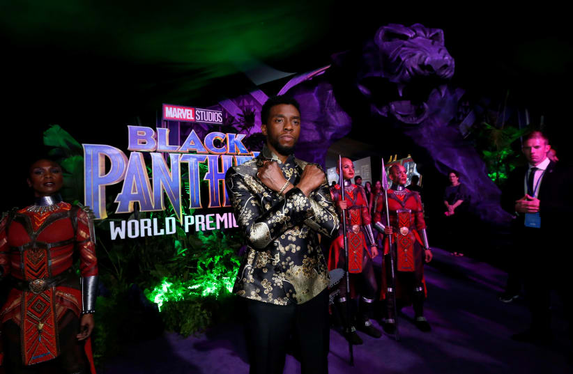 Cast member Chadwick Boseman poses at the premiere of "Black Panther" in Los Angeles, California, January 29, 2018. (photo credit: MARIO ANZUONI/REUTERS)