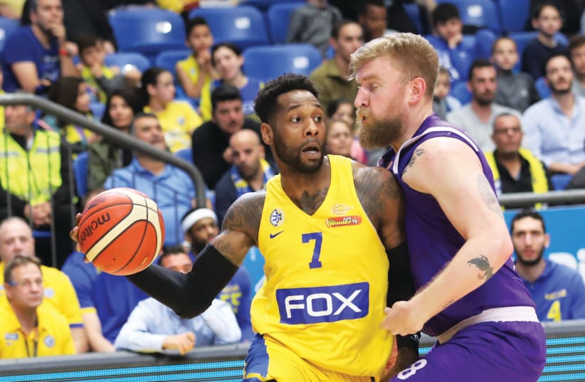 Maccabi Tel Aviv guard DeAndre Kane (left) had 12 points and five rebounds in last night’s 95-86 win over Igor Nesterenko (right) and Ironi Nahariya in BSL action at Yad Eliyahu Arena. (photo credit: DANNY MARON)