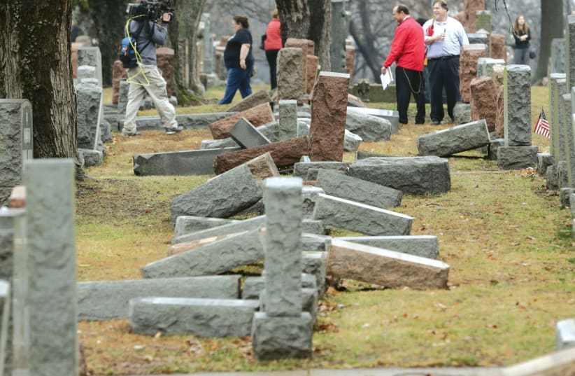 Grave stones tipped over after a antisemitic attack in the US (photo credit: REUTERS)