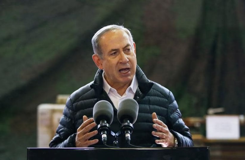  Israeli Prime Minister Benjamin Netanyahu speaks during a visit of an army base in the West Bank settlement of Beit El near Ramallah January 10, 2017 (photo credit: BAZ RATNER/REUTERS)