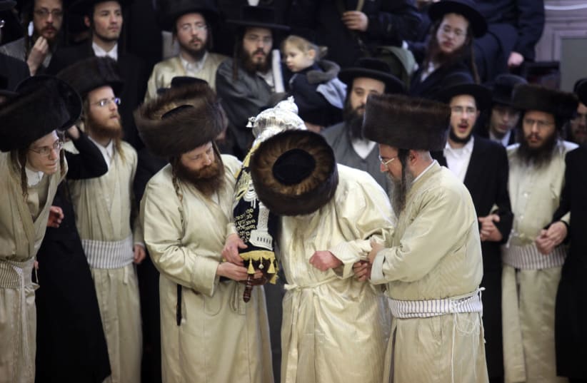Rabbis dedicate a new torah scroll (photo credit: MARC ISRAEL SELLEM/THE JERUSALEM POST)