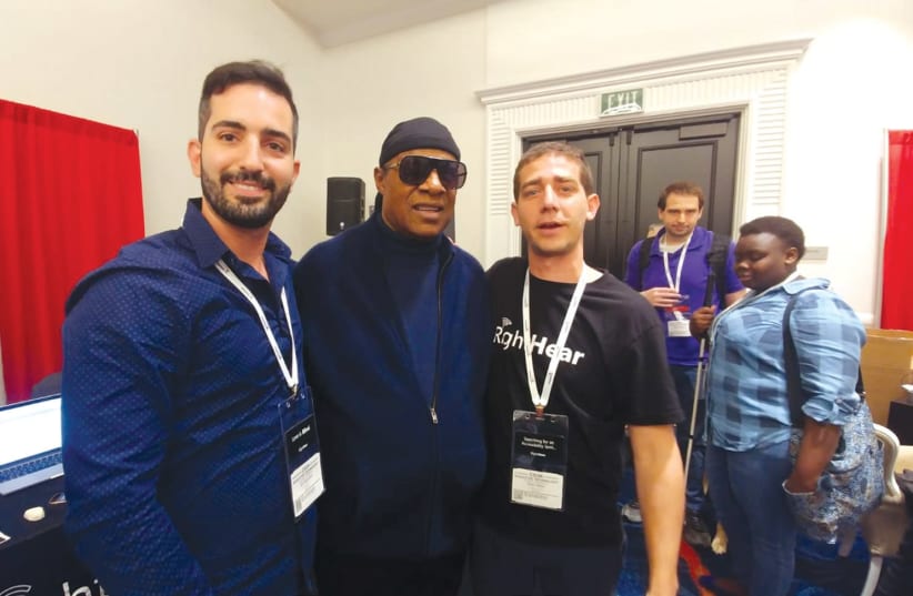 Stevie Wonder visits with Israeli start-up RightHear at a convention in California (photo credit: Courtesy)