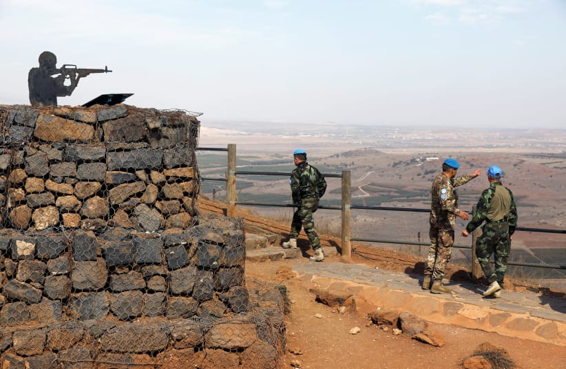 U.N. peacekeepers patrol Mount Bental, an observation post in the Golan Heights near the ceasefire line between Israel and Syria October 23, 2017.  (photo credit: REUTERS/AMIR COHEN)