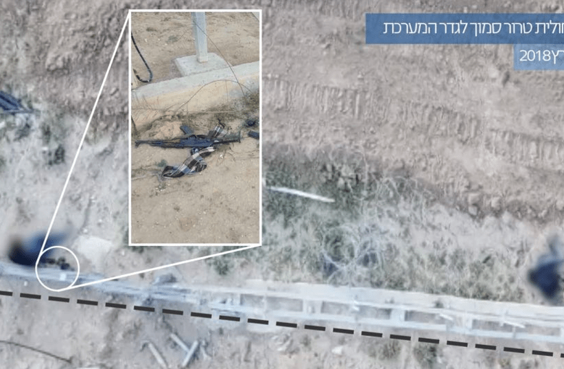 Weapons found by the border fence, the Hebrew caption says foiling a terrorist squad near the security fence March 30 2018    (photo credit: IDF SPOKESMAN’S UNIT)