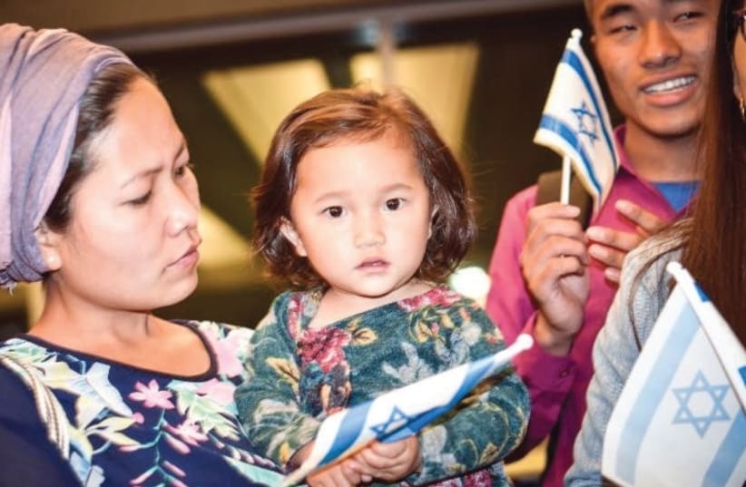 NURIT HAOKIP and her 18-month-old daughter Revital celebrate at Ben-Gurion Airport after making aliya this week from India. (photo credit: LAURA BEN-DAVID/SHAVEI ISRAEL)