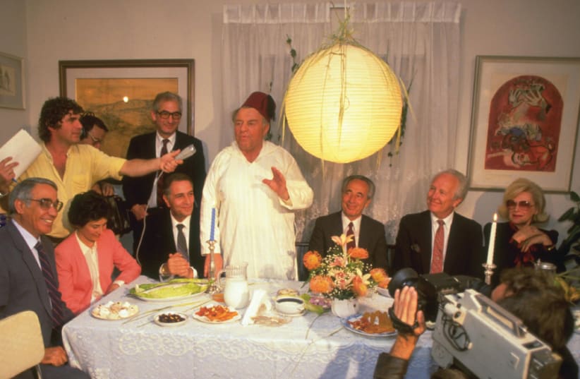Legendary Jerusalem mayor Teddy Kollek hosts a post-Passover Mimouna celebration in his home, together with prime minister Shimon Peres and US consul-general Morris Draper, in 1986 (photo credit: NATI HARNIK/GPO)