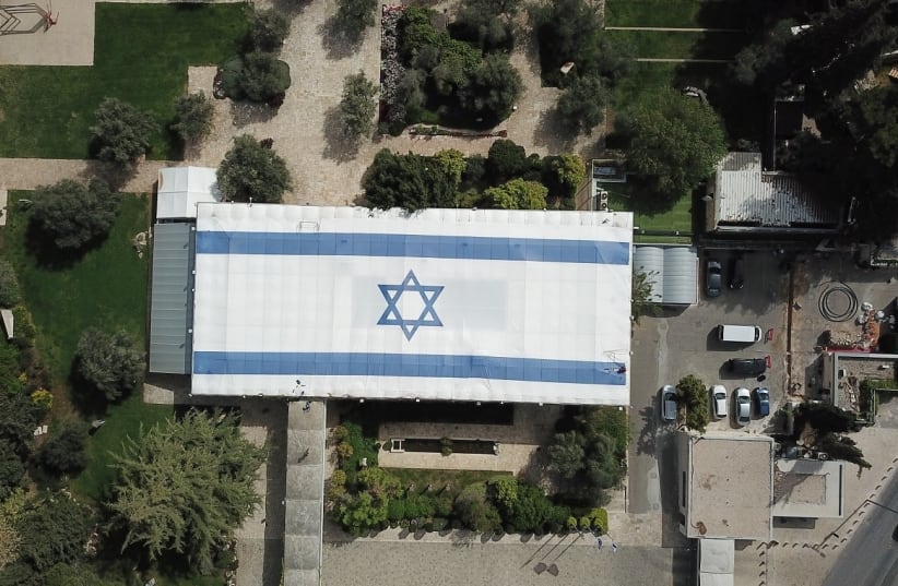 An Israeli flag is spread out on top of the president's residence for Independence Day (photo credit: PRESIDENTIAL SPOKESPERSON OFFICE)