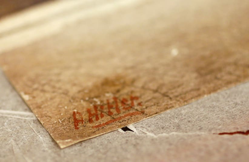 Hitler's signature on the corner of an oil painting at the Weidler auction house (photo credit: REUTERS/KAI PFAFFENBACH)