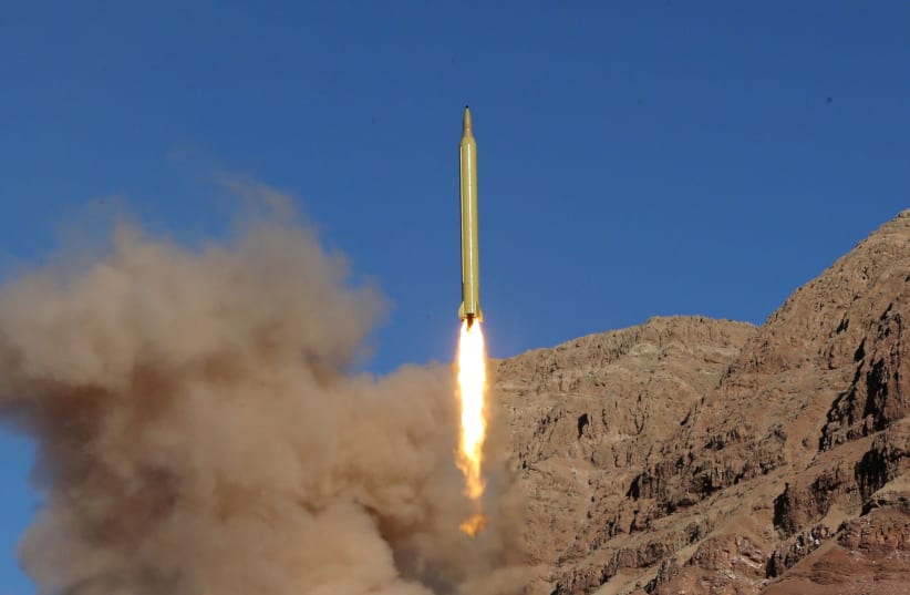 An Iranian missle launches from a test site (photo credit: MAHMOOD HOSSEINI/REUTERS)