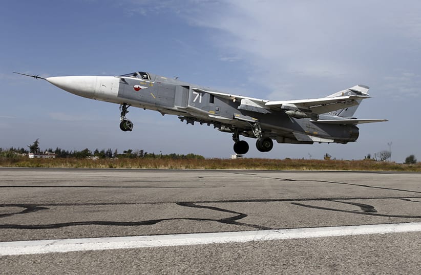 A Sukhoi Su-24 fighter jet takes off from the Hmeymim air base near Latakia, Syria, in this handout photograph released by Russia's Defence Ministry (photo credit: REUTERS/MINISTRY OF DEFENSE OF THE RUSSIAN FEDERATION/HANDOUT VIA REUTERS)