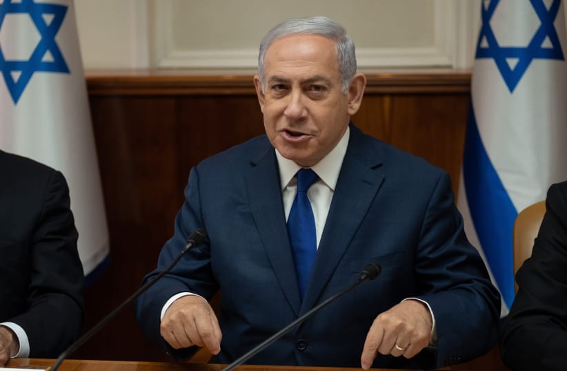Prime Minister Benjamin Netanyahu at a cabinet meeting (photo credit: YOAV DAVIDKOVITZ / POOL)