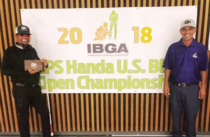 Israeli golfer Zohar Sharon (left) added yet another title to his long resume when he won the ISPS Handa 2018 US Blind Golf Open at the Haven Golf Course in Green Valley Arizona at the start of the week with the help of caddie Shimshon Levi (right) (photo credit: Courtesy)