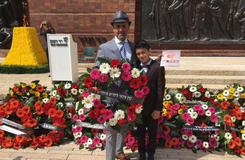 Albert Shaltiel and his son Ilai at the Holocaust Day wreath laying (photo credit: JULIJA LEVIN)