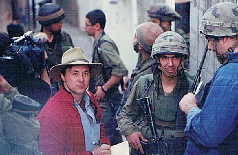 ARIEH O’SULLIVAN speaks to paratroopers in the Balata refugee camp in Nablus during the Second Intifada (photo credit: Courtesy)