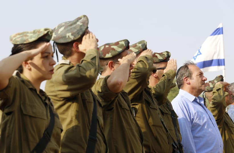 President and Founder of the International Fellowship of Christians and Jews, Rabbi Yechiel Eckstein, is seen with IDF soliders; the Fellowship is heavily invested in supporting its lone soldiers (photo credit: COURTESY IFCJ)