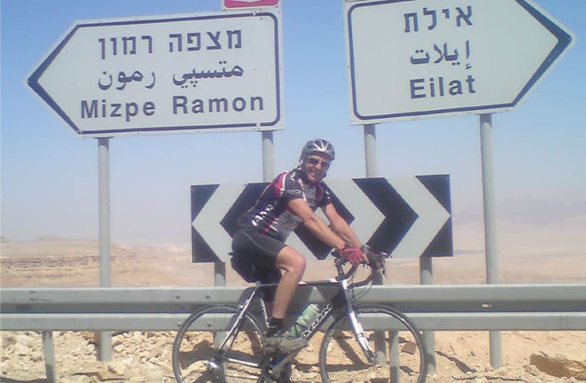 The writer, Barry Davis, on Eagle Hill, just before the long descent to the Arava highway, around 55 km. before Eilat (photo credit: BARRY DAVIS)