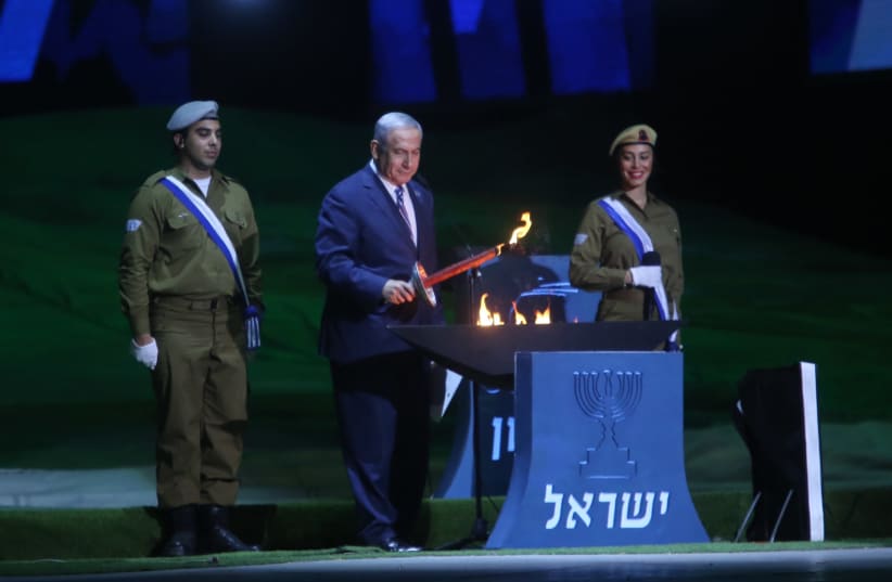 Prime Minister Benjamin Netanyahu at the torch light ceremony at Mt. Herzl, April 18, 2018 (photo credit: MARC ISRAEL SELLEM/THE JERUSALEM POST)