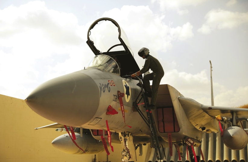 An Israeli pilot enters his aircraft. (photo credit: REUTERS)