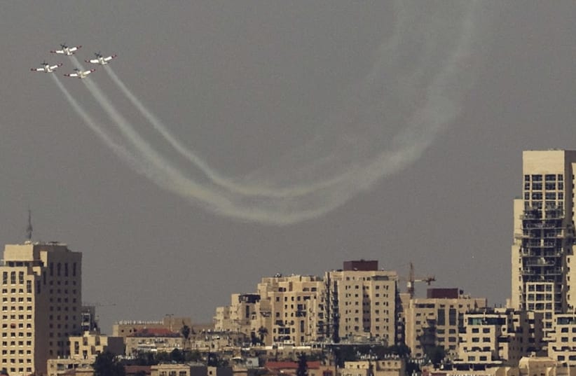 AN ISRAEL AIR FORCE aerobatic team flies in formation during an aerial show for Independence Day over Jerusalem on April 19th, 2018. (photo credit: REUTERS)