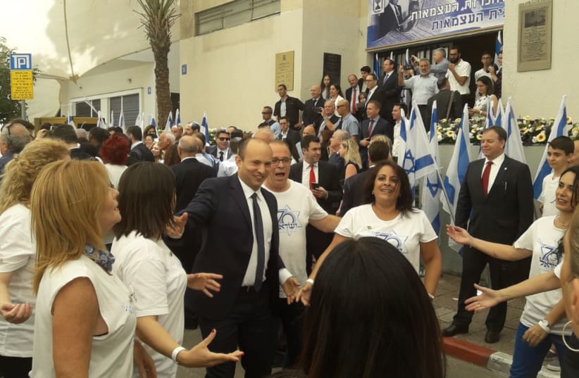 Education Minister Naftali Bennett joins the crowd in dancing the Hora during festivities in honor of Israel's 70th Independence Day at Independence Hall in Tel Aviv, April 2018 (photo credit: YANIR COZIN / MAARIV)