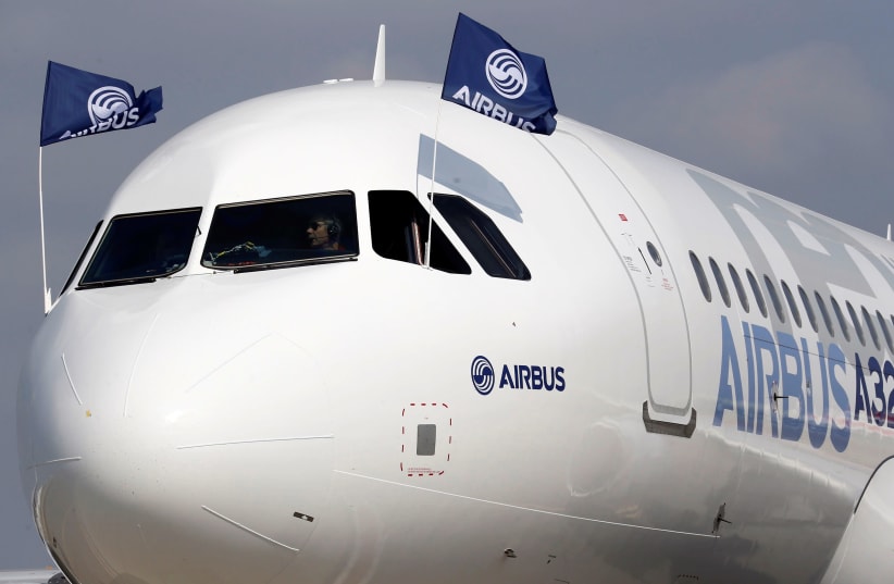 Flight test engineers drive the Airbus A320neo (New Engine Option) after its first flight in Colomiers near Toulouse, southwestern France, September 25, 2014. (photo credit: REUTERS/REGIS DUVIGNAU)