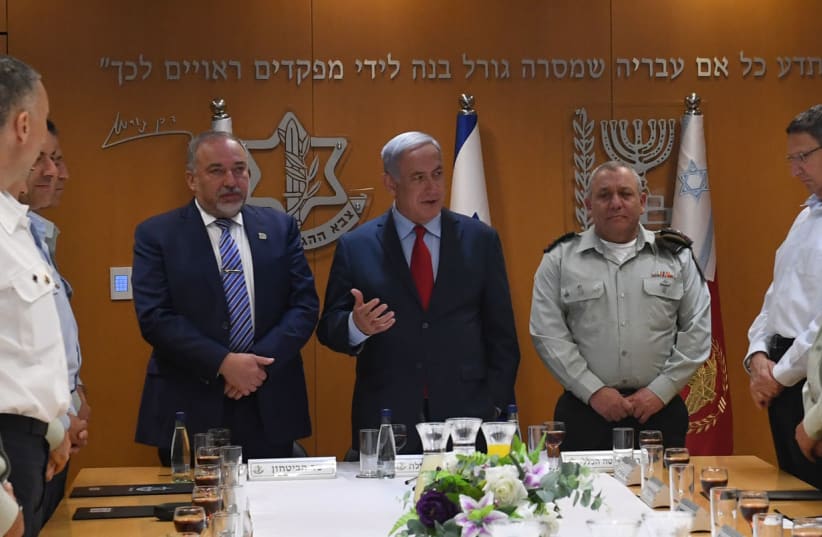 Prime Minister Benjamin Netanyahu, Defense Minister Avigdor Liberman, IDF Chief of Staff Gadi Eisenkot at a toast to Israel's 70th anniversary on April 22, 2018. (photo credit: KOBI GIDON / GPO)