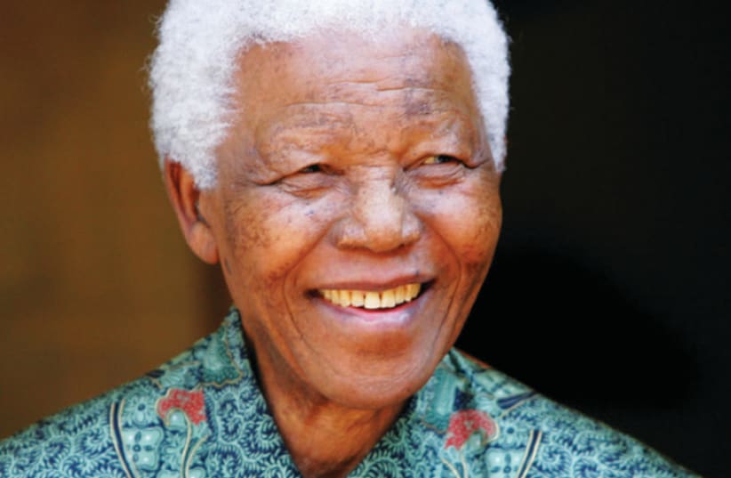 Nelson Mandela outside his home in 2005 (photo credit: REUTERS/MIKE HUTCHINGS)